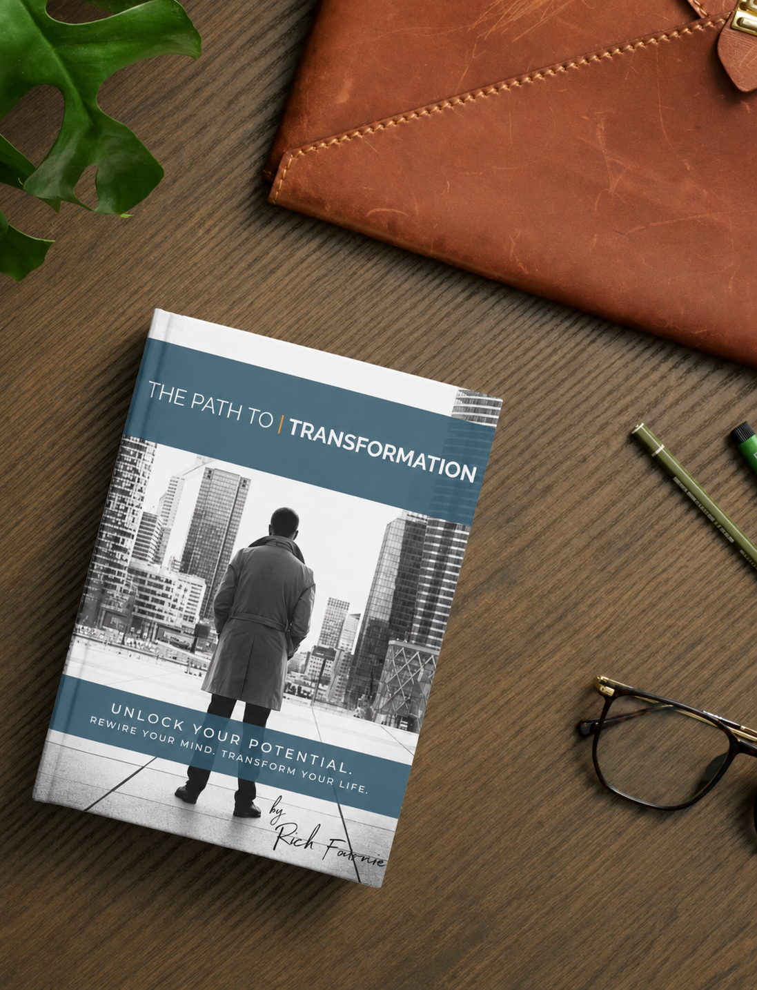 The Path To Transformation physical workbook resting on a desk